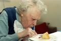Grandma Eating A Cake